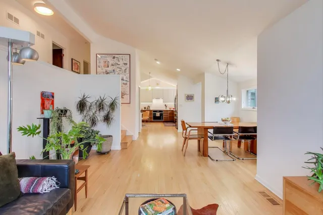 a living room with furniture and a table