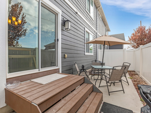 12214 Sunpark Lane Draper, UT 84020 - Photo 19 of 24 View of patio featuring outdoor dining area and a wooden deck