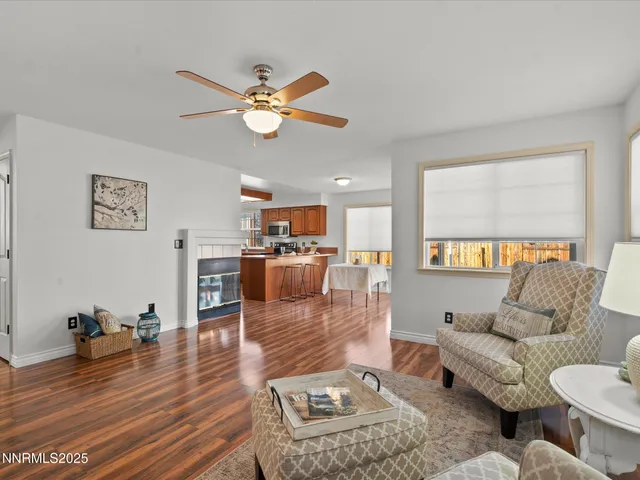 an aerial view of a city with lots of residential buildings and mountain view in back