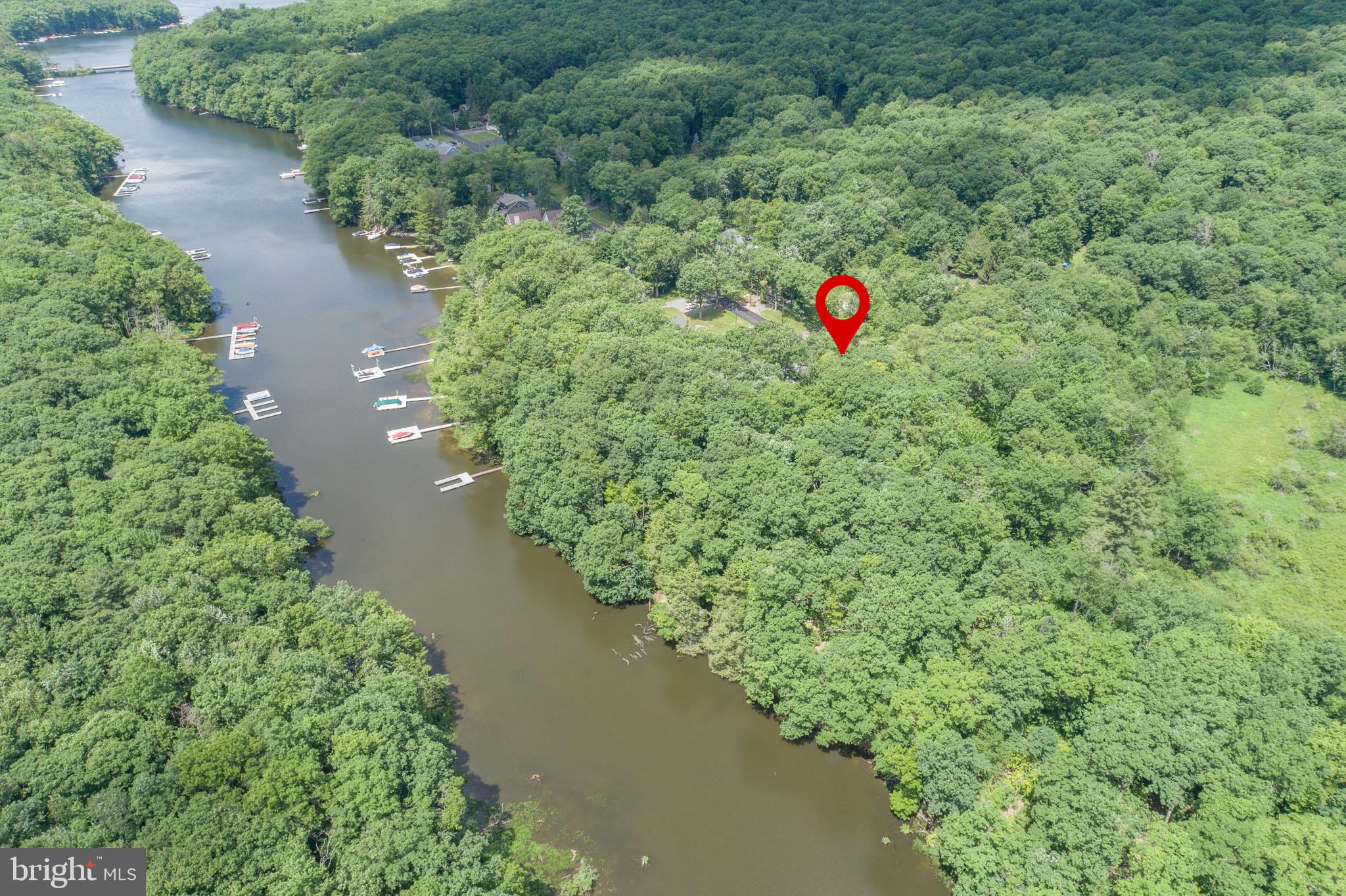 509 Brant Road Swanton, MD 21561 - Photo 10 of 21 an aerial view of a house with a yard and lake view