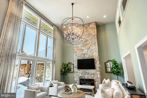 a kitchen with stainless steel appliances granite countertop a sink and a refrigerator