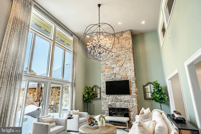 a kitchen with stainless steel appliances granite countertop a sink and a refrigerator