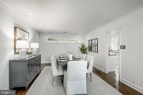 a kitchen with granite countertop white cabinets and stainless steel appliances