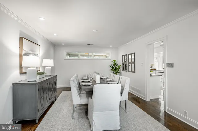 a kitchen with granite countertop white cabinets and stainless steel appliances