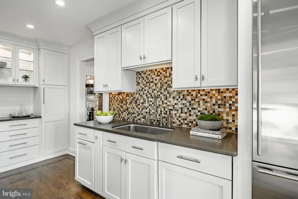 a kitchen with stainless steel appliances granite countertop a stove and a sink