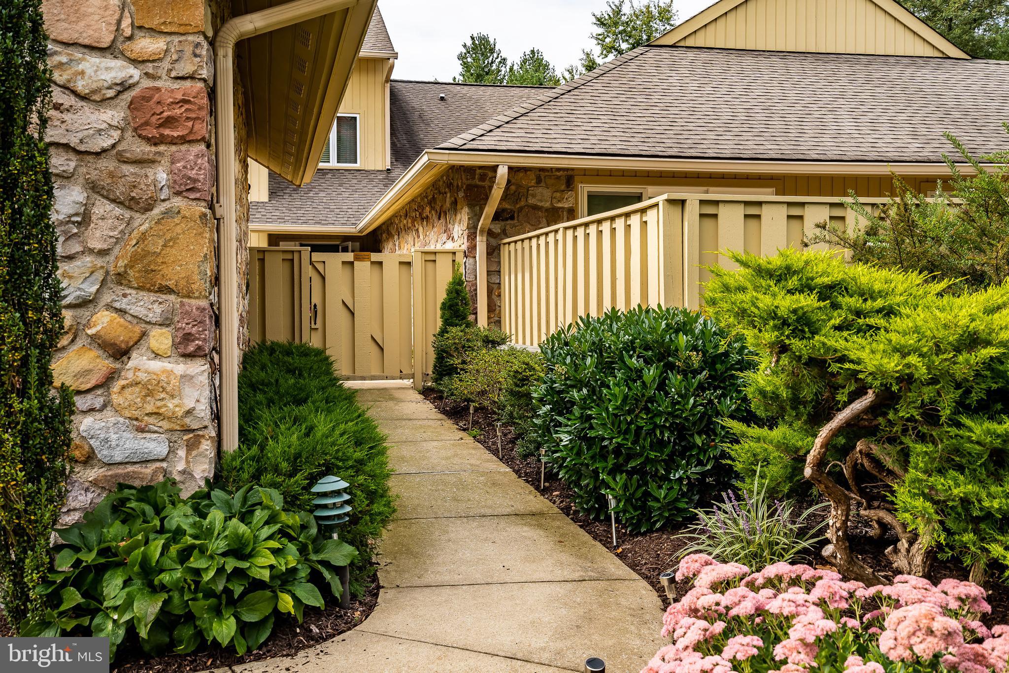 1256 Round Hill Road Bryn Mawr, PA 19010 - Photo 2 of 65 a front view of a house with garden