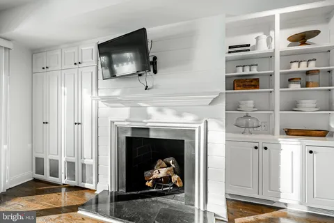 a bathroom with a sink and mirror with toilet
