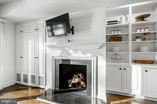 a bathroom with a sink and mirror with toilet
