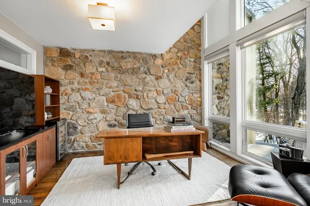 a view of a kitchen with a sink and cabinets