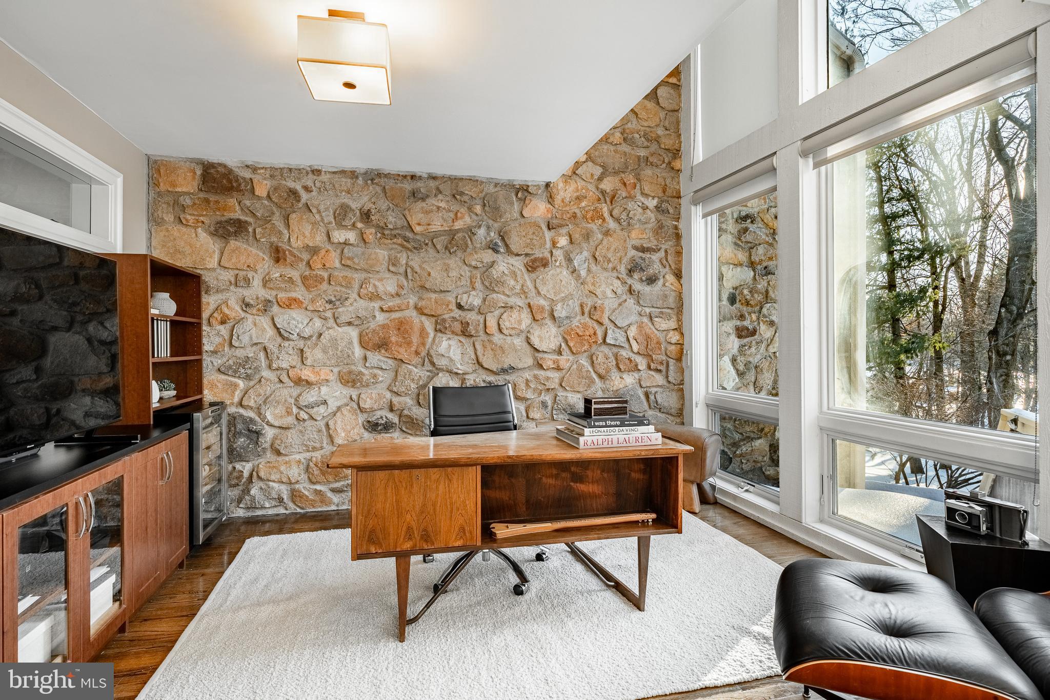 1256 Round Hill Road Bryn Mawr, PA 19010 - Photo 26 of 65 a living room with fireplace furniture and a flat screen tv