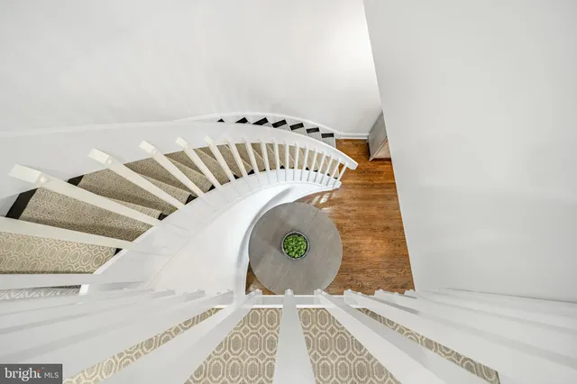 a bathroom with a granite countertop sink shower and a mirror