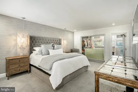 a bathroom with a granite countertop sink a mirror and shower