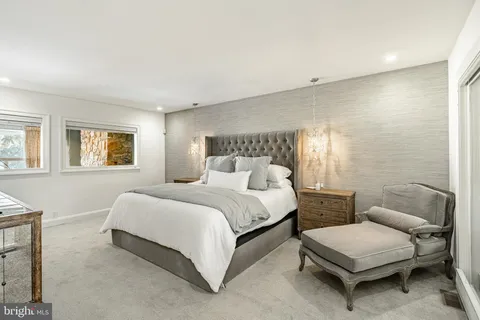 a bathroom with a granite countertop shower mirror and a sink