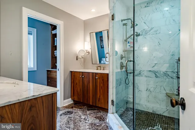 a bedroom with a bed and a mirror