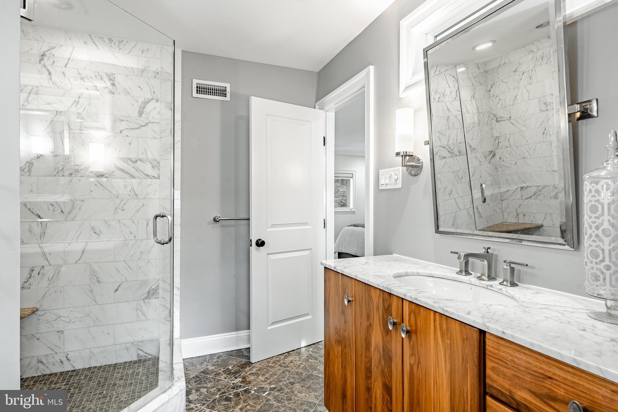 1256 Round Hill Road Bryn Mawr, PA 19010 - Photo 36 of 65 a bathroom with a granite countertop sink shower and a mirror
