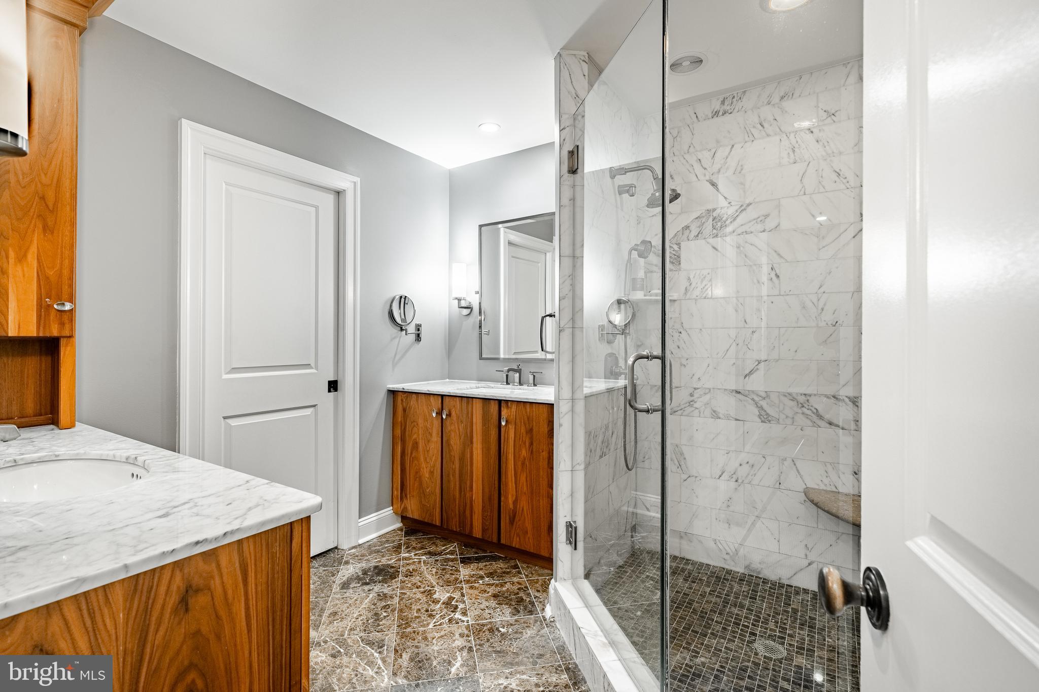 1256 Round Hill Road Bryn Mawr, PA 19010 - Photo 38 of 65 a bathroom with a granite countertop sink a mirror and shower