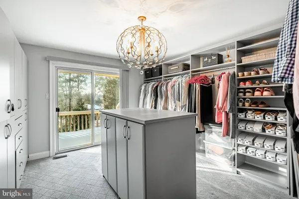 a view of a workspace with furniture and wooden floor