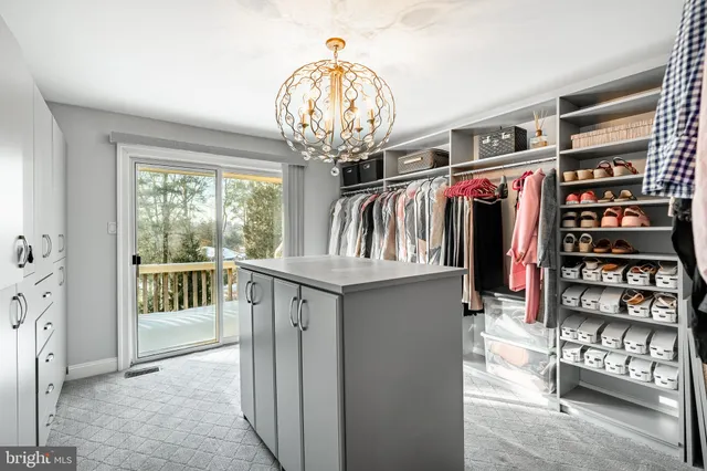 a view of a workspace with furniture and wooden floor