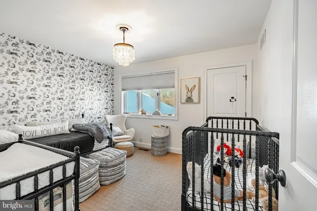 a view of a balcony dining table and chairs