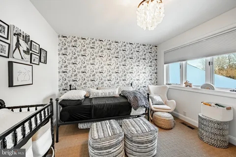 a view of a balcony with table and chairs