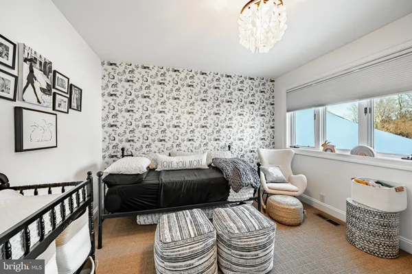 a view of a balcony with table and chairs