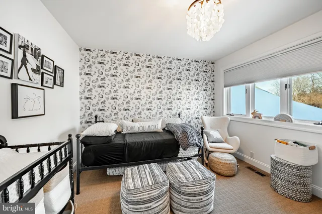 a view of a balcony with table and chairs