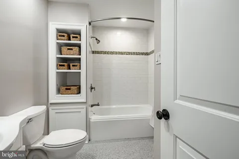 a view of a house with a yard balcony and sitting area