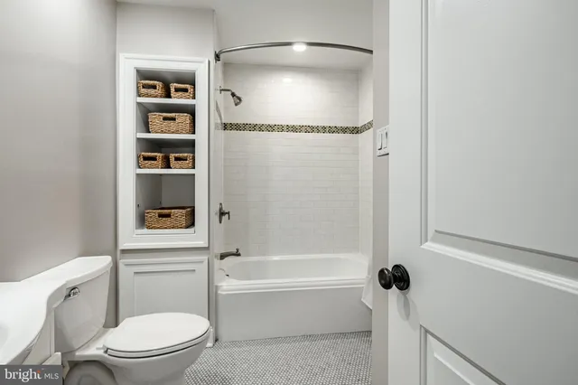 a view of a house with a yard balcony and sitting area