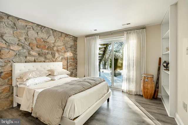 a view of a big building with big yard and large trees