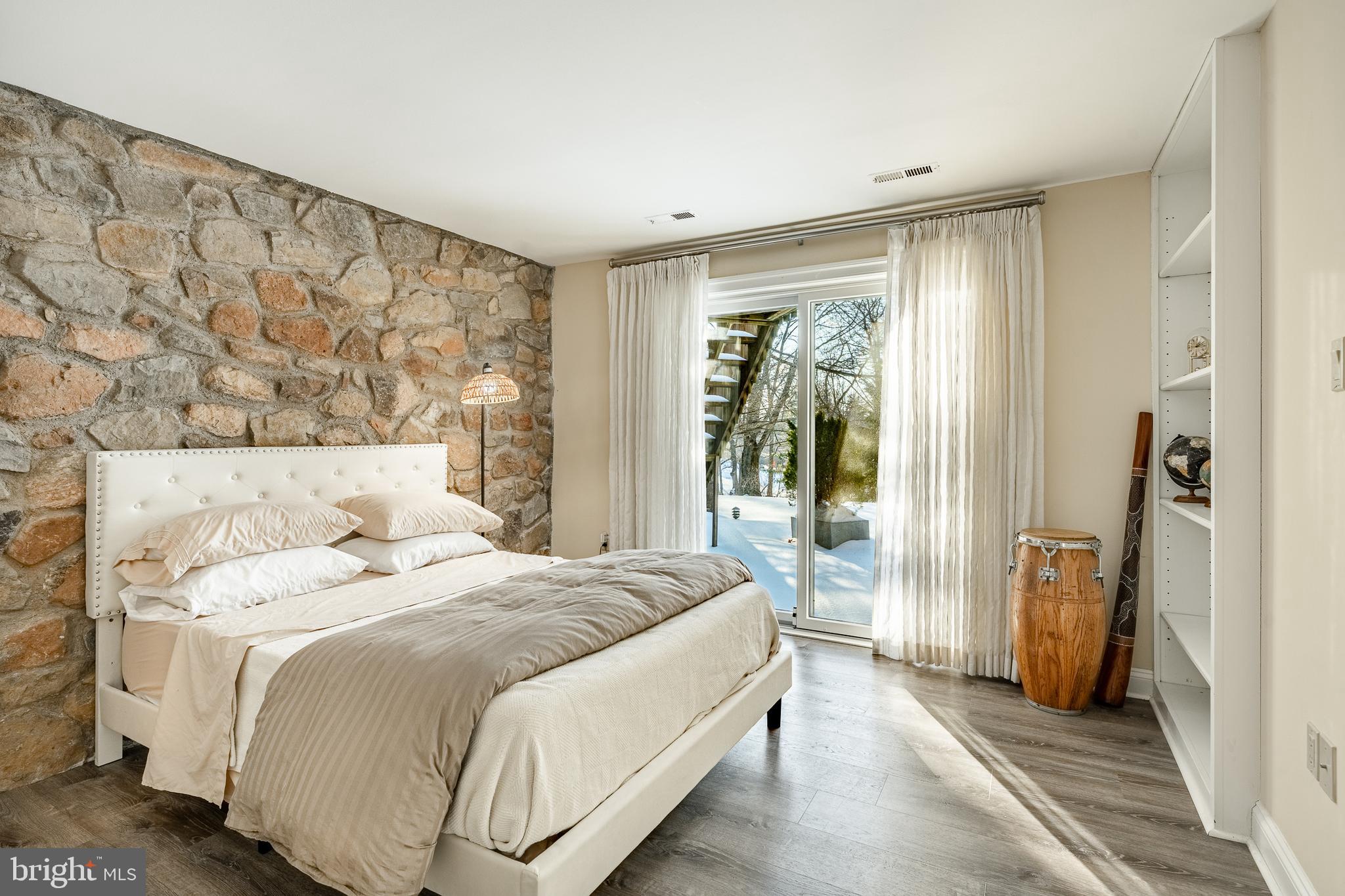 1256 Round Hill Road Bryn Mawr, PA 19010 - Photo 47 of 65 a bedroom with a bed and a mirror