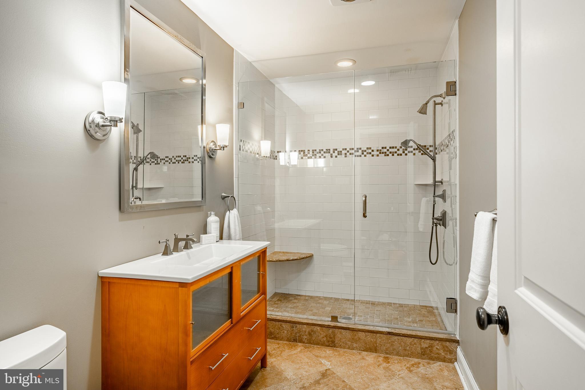 1256 Round Hill Road Bryn Mawr, PA 19010 - Photo 49 of 65 a bathroom with a tub sink shower and mirror