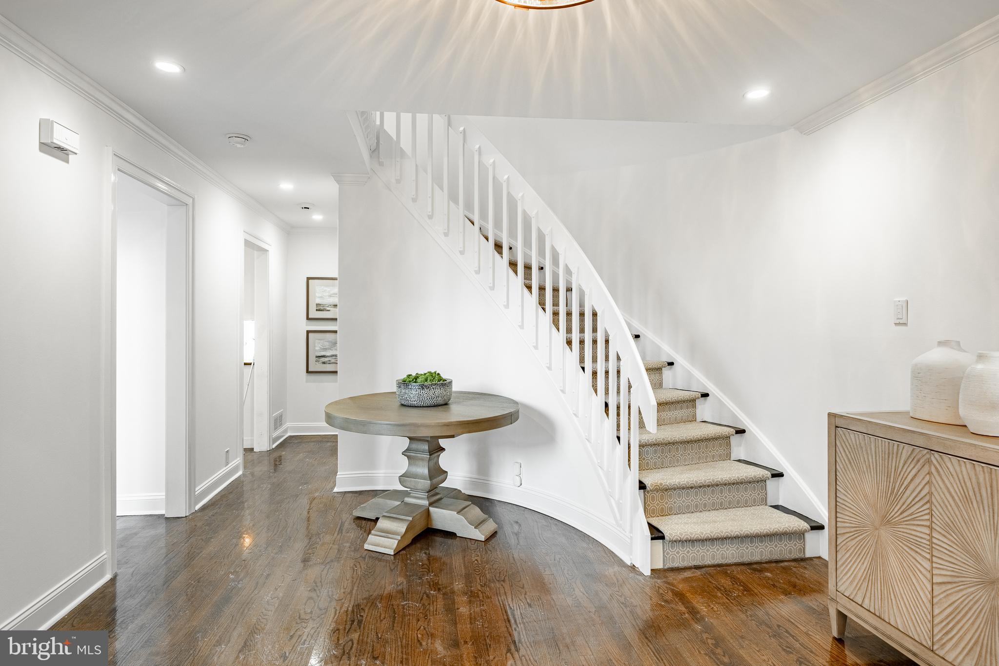 1256 Round Hill Road Bryn Mawr, PA 19010 - Photo 5 of 65 a view of entryway and hall with wooden floor