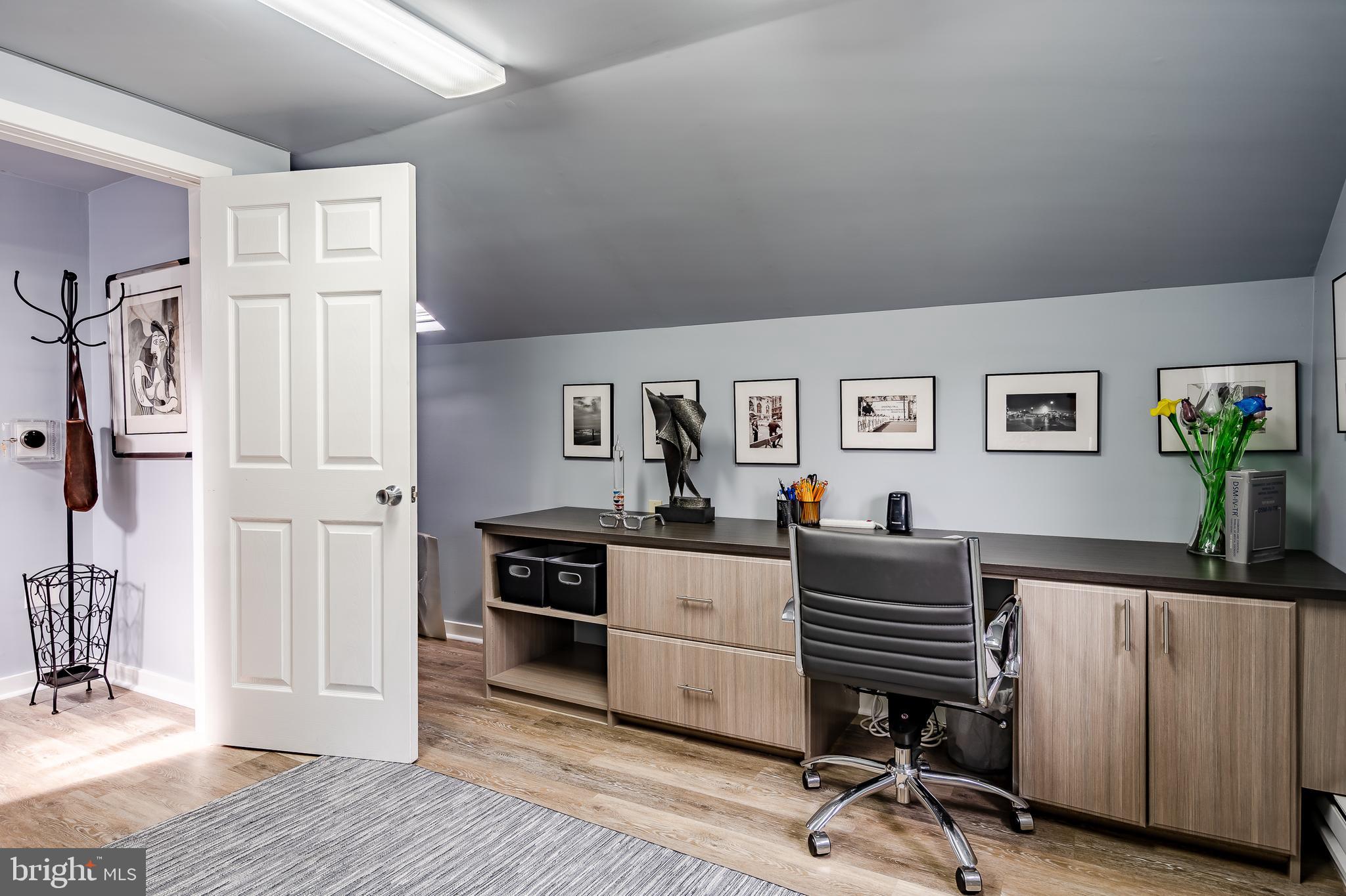 1256 Round Hill Road Bryn Mawr, PA 19010 - Photo 53 of 65 a view of a workspace with furniture and wooden floor