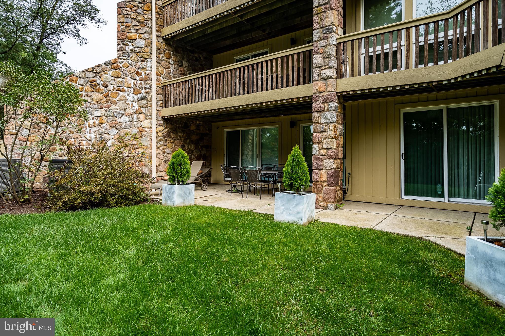 1256 Round Hill Road Bryn Mawr, PA 19010 - Photo 60 of 65 a view of a house with a yard balcony and sitting area