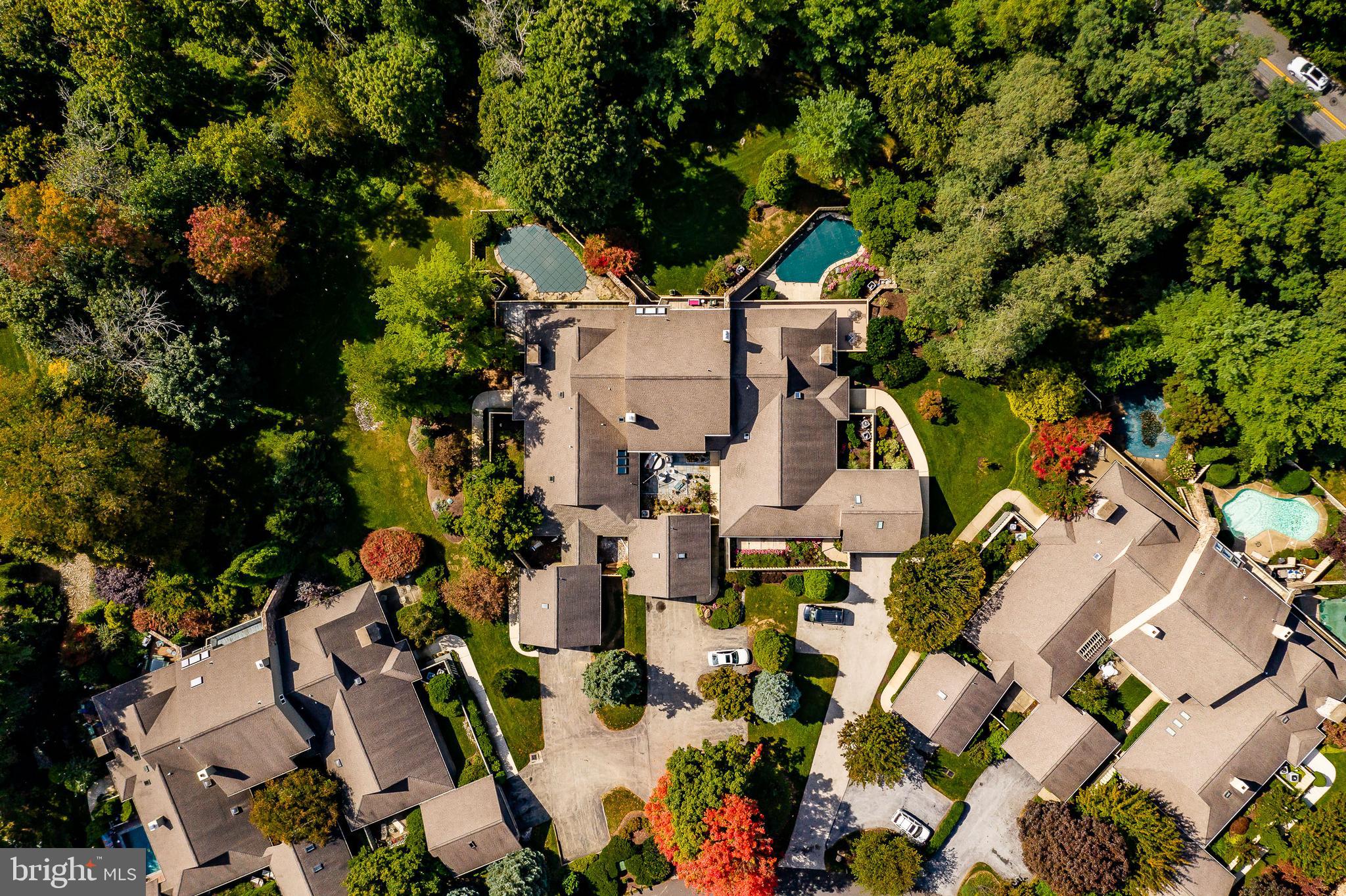 1256 Round Hill Road Bryn Mawr, PA 19010 - Photo 64 of 65 an aerial view of multiple houses with yard