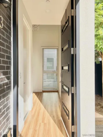 a view of walk in closet with empty room