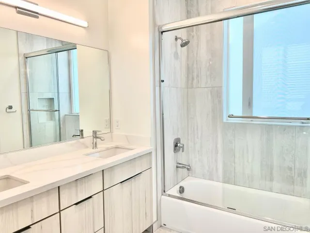 a bathroom with a bathtub and a sink