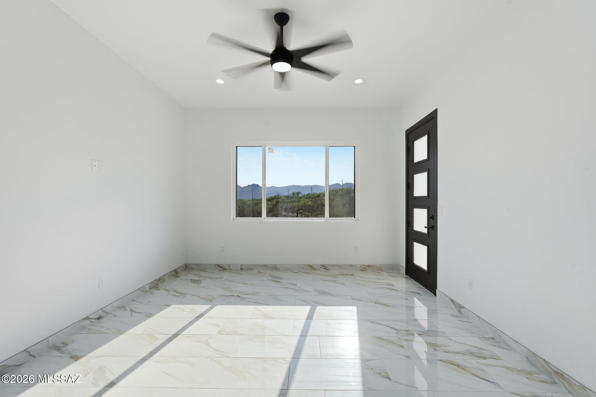 1786 Peralta Court Rio Rico, AZ 85648 - Photo 28 of 50 a view of an empty room with a window