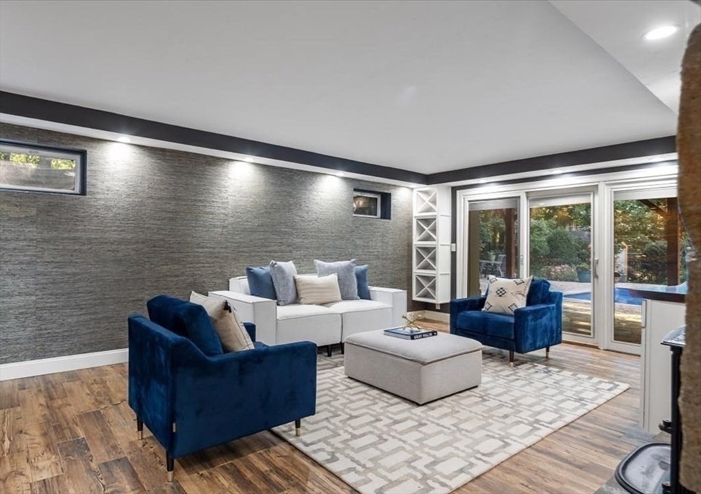 6 Grist Mill Lane Hingham, MA 02043 - Photo 1 of 17 a living room with furniture and a floor to ceiling window