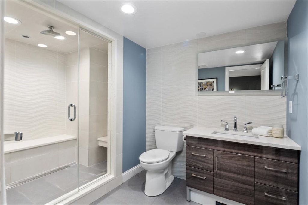 6 Grist Mill Lane Hingham, MA 02043 - Photo 12 of 17 a bathroom with a toilet a sink and a bathtub