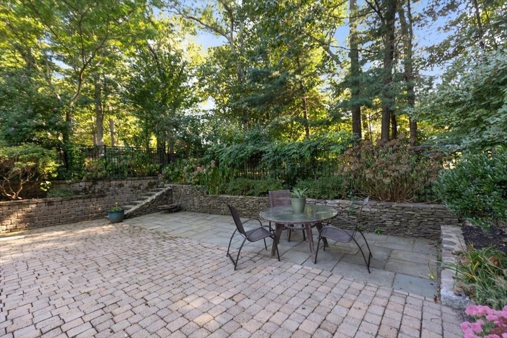 6 Grist Mill Lane Hingham, MA 02043 - Photo 15 of 17 a view of a patio with table and chairs and potted plants