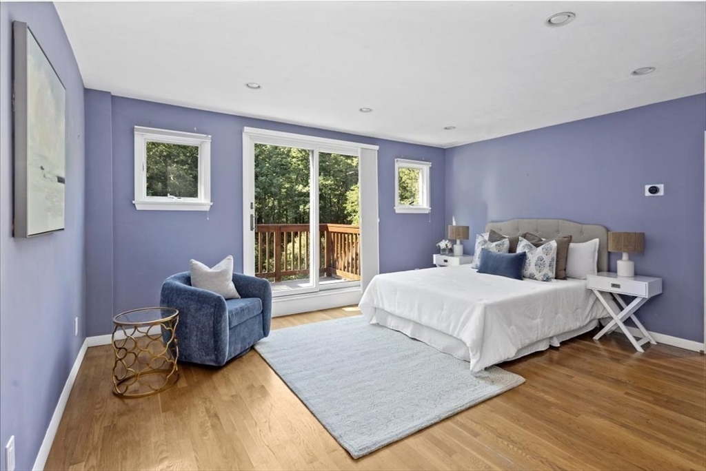 6 Grist Mill Lane Hingham, MA 02043 - Photo 10 of 17 a spacious bedroom with a bed and a couch