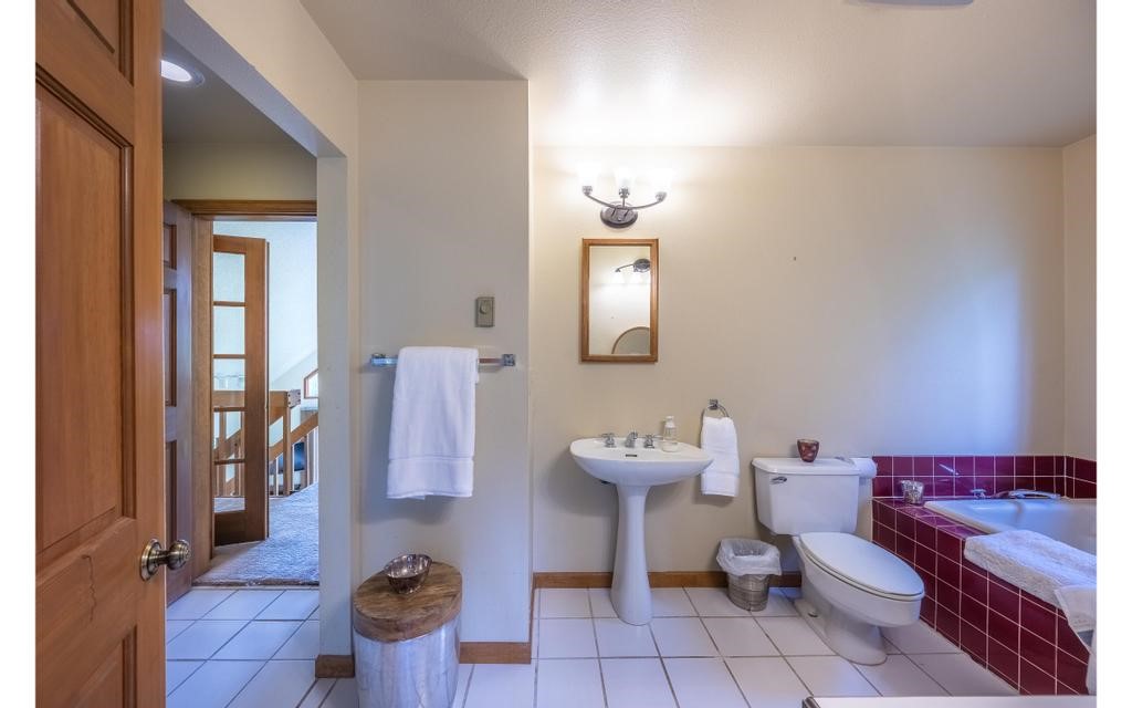 326 Spring Beauty Drive Silverthorne, CO 80498 - Photo 13 of 33 a bathroom with a sink mirror and toilet