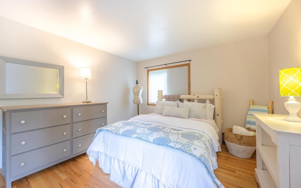 326 Spring Beauty Drive Silverthorne, CO 80498 - Photo 16 of 33 a bedroom with a bed and a flat screen tv