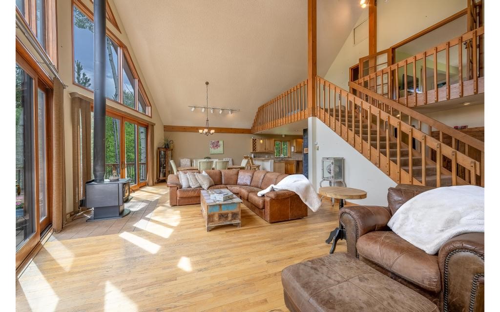 326 Spring Beauty Drive Silverthorne, CO 80498 - Photo 2 of 33 a living room with furniture or a rug and a large window