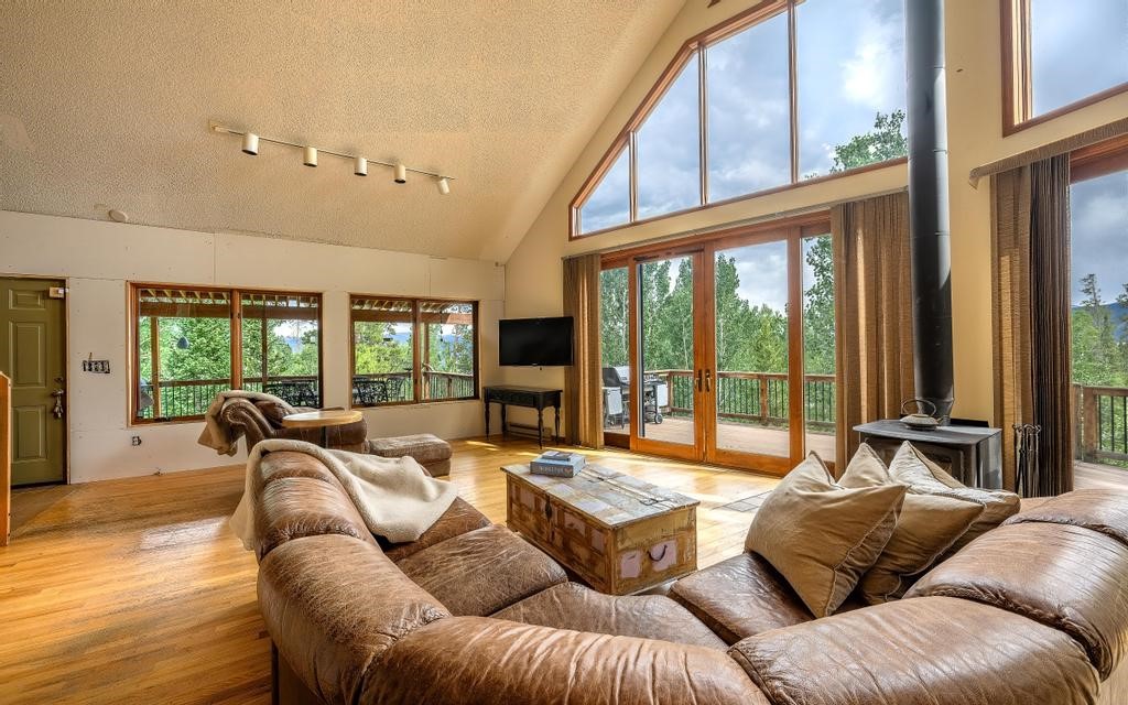 326 Spring Beauty Drive Silverthorne, CO 80498 - Photo 5 of 33 a living room with furniture and large windows