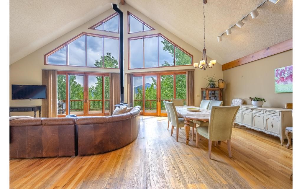 326 Spring Beauty Drive Silverthorne, CO 80498 - Photo 6 of 33 a living room with furniture and a large window