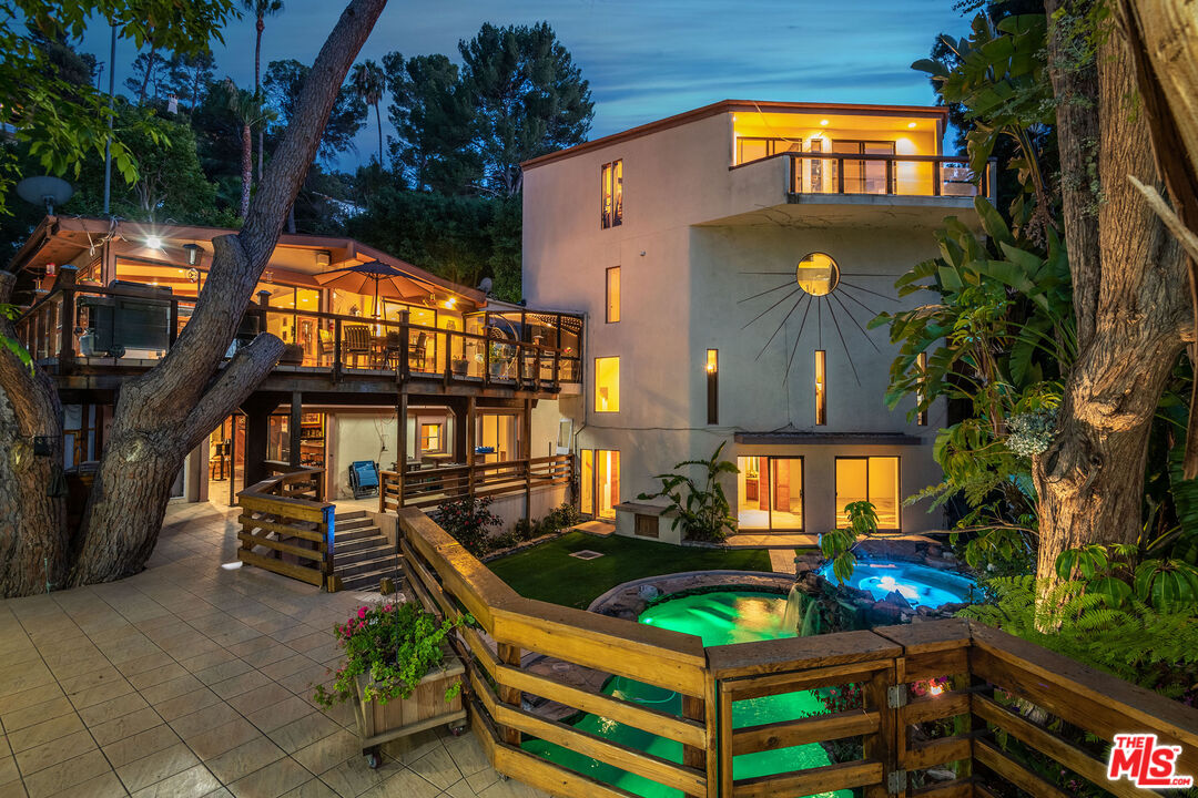 3572 Multiview Drive Los Angeles, CA 90068 - Photo 2 of 51 a front view of a house with a garden