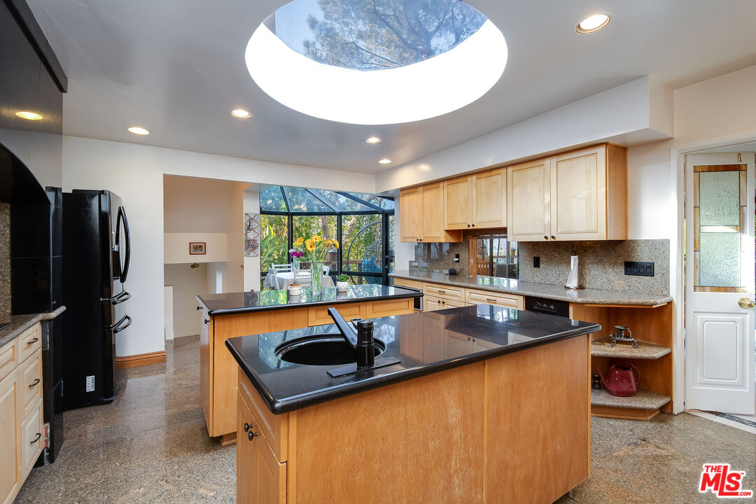 3572 Multiview Drive Los Angeles, CA 90068 - Photo 28 of 51 a kitchen with a refrigerator a sink and a stove