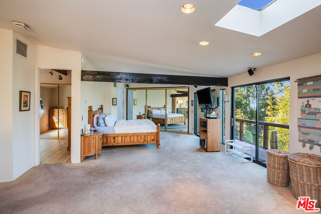 3572 Multiview Drive Los Angeles, CA 90068 - Photo 30 of 51 a living room with furniture and large windows